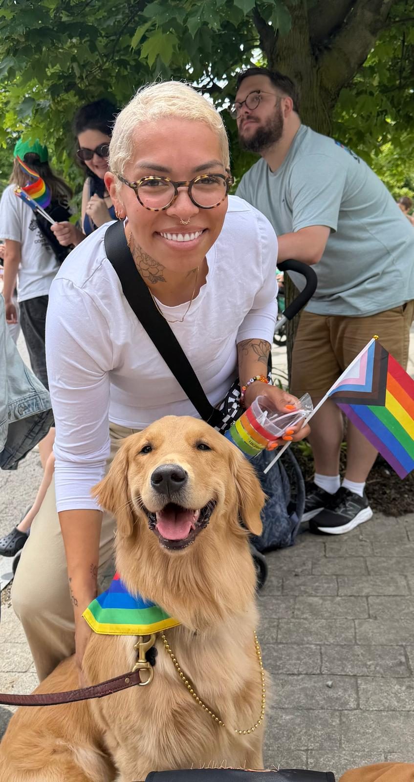 Flurry in a rainbow bandana with a member of the team at a Pride event