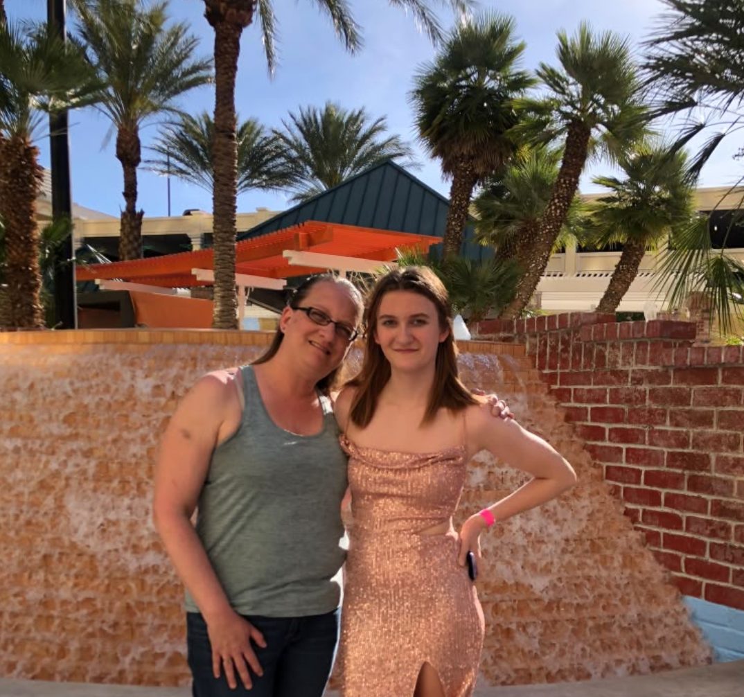 Two of Jessicaβs family on a sunny day out among palm trees